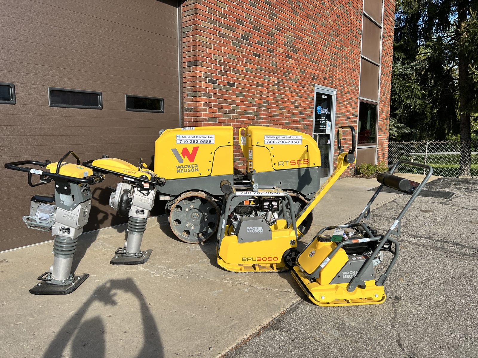 Wacker Neuson rammers, plate compactor, and RTSC3 trench roller staged outside General Rental's Steubenville headquarters